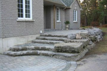 Front entrance stairs of natural and cultured stone