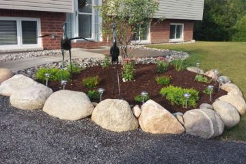 Front entrance garden bed with river rock
